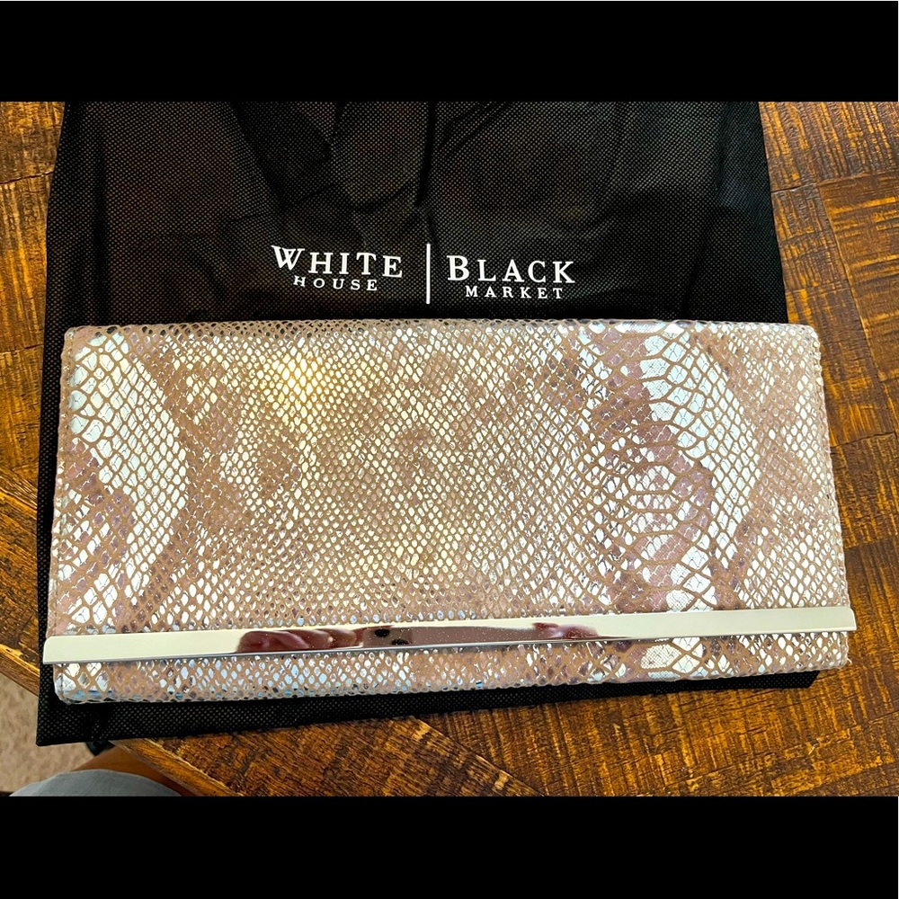White House Black Market silver snakeskin print clutch.